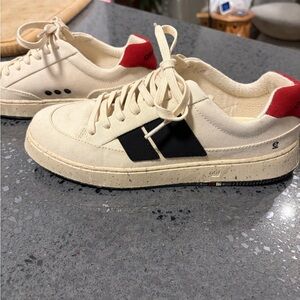 Stylish Cream Sneakers with Red and Black Details